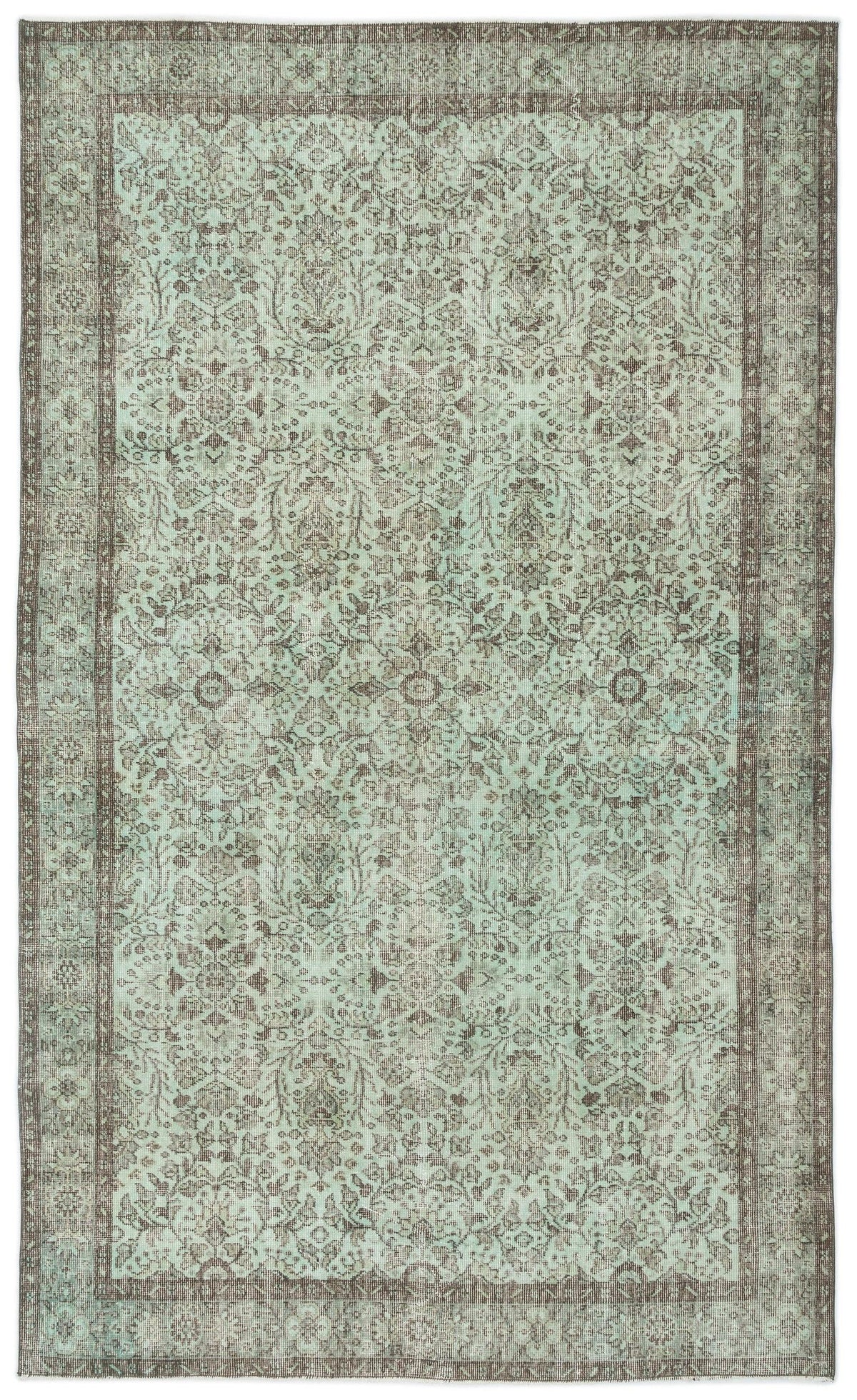Distressed mint green and brown rug with a traditional ornate floral medallion pattern and a wide decorative border.