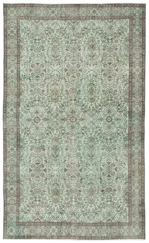 Load image 1 in gallery view. Distressed mint green and brown rug with a traditional ornate floral medallion pattern and a wide decorative border.