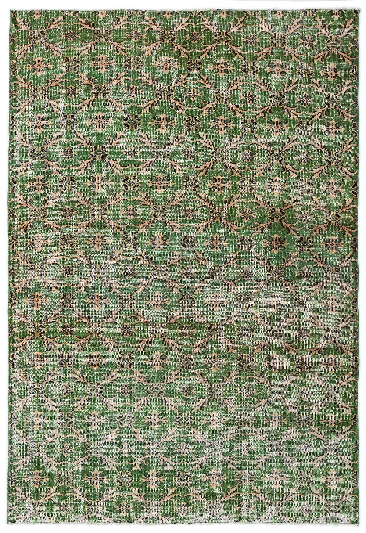 Green distressed rug with a repeating beige and black floral medallion pattern.
