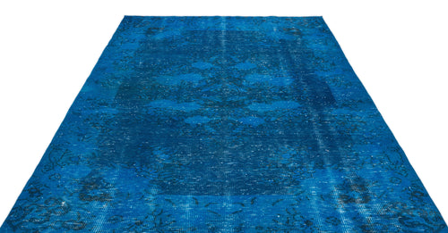 Load image 1 in gallery view. Vibrant blue distressed rug with a faded traditional medallion pattern on a white background.