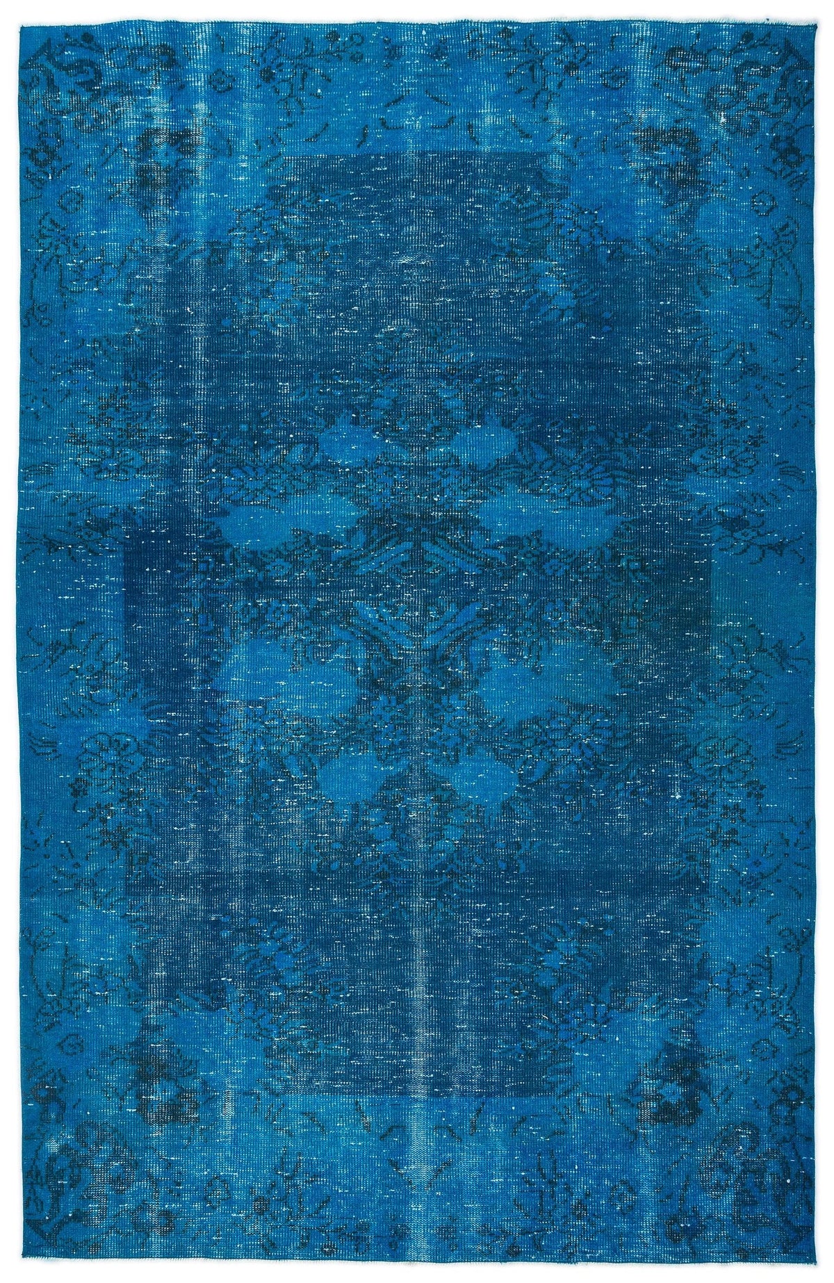 Monochromatic blue distressed rug with a faded traditional floral medallion pattern.