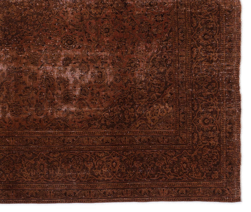 Load image 1 in gallery view. Deep brown vintage-style rug with a distressed floral medallion pattern and a detailed border.