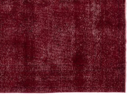 Load image 1 in gallery view. Deep red vintage-style rug with a distressed, faded texture and subtle border detail.