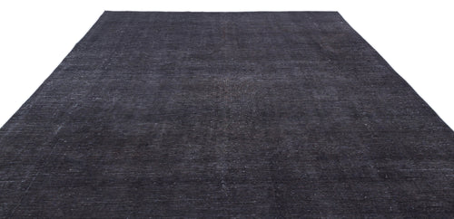 Load image 1 in gallery view. Solid charcoal black rug with a distressed, low-pile texture on a white background.