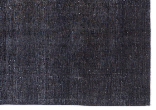 Load image 1 in gallery view. Solid charcoal black rug with a distressed, weathered texture and visible woven fiber details.