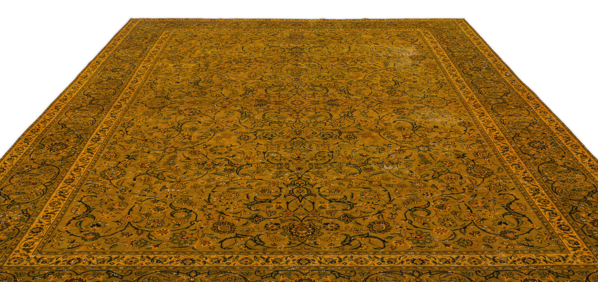 Mustard yellow traditional rug with an intricate black and multi-colored floral vine pattern and a wide border.