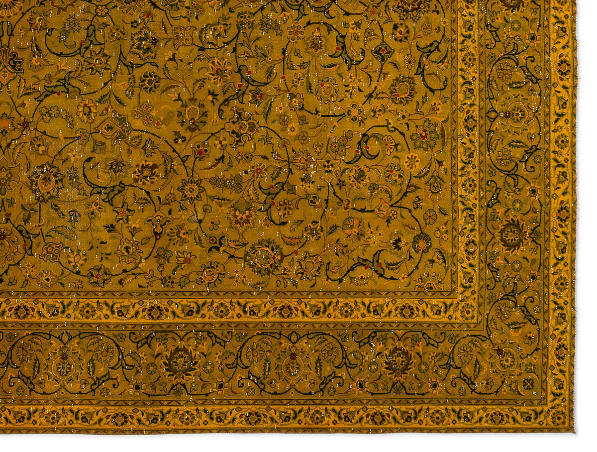 Mustard yellow traditional rug with intricate black and multi-colored floral vine patterns and a decorative border.
