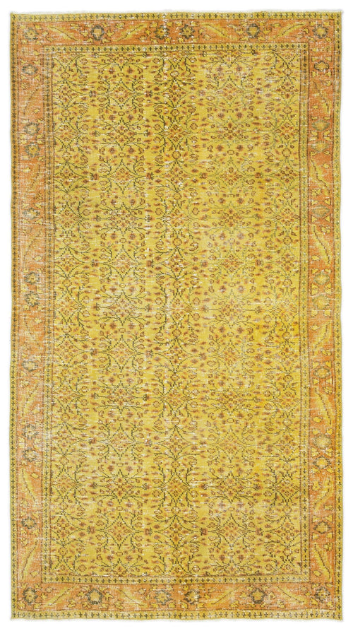Load image 1 in gallery view. Yellow and orange vintage-style rug with a distressed floral medallion pattern and a decorative border.