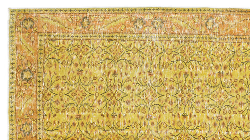 Load image 1 in gallery view. Mustard yellow and orange vintage-style rug with a distressed floral pattern and a decorative border.