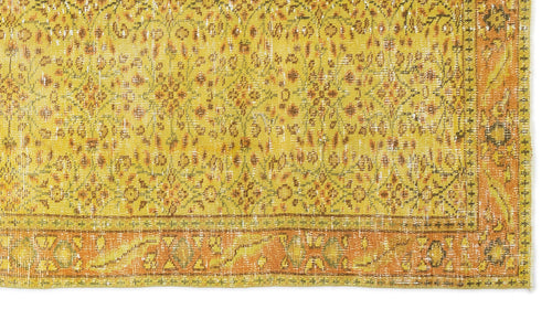 Load image 1 in gallery view. Mustard yellow and orange distressed rug with a traditional floral medallion pattern and a wide decorative border.