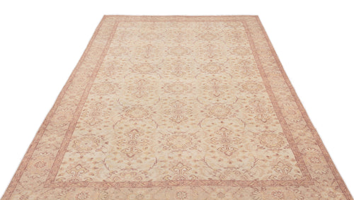 Load image 1 in gallery view. Beige and muted red traditional area rug with a repeating floral medallion pattern and a decorative border.