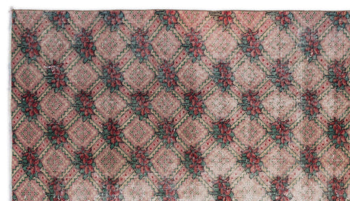 Load image 1 in gallery view. Pink, red, and green rug with a repeating diamond lattice pattern featuring floral motifs at each intersection.