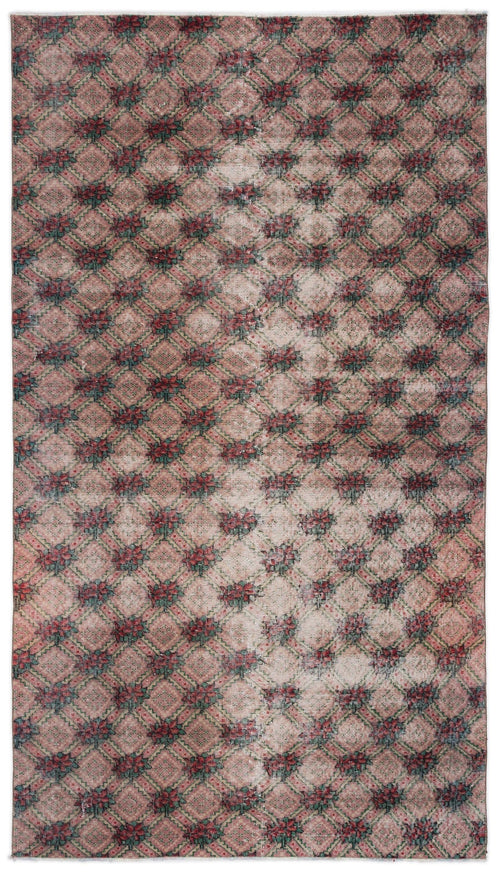 Load image 1 in gallery view. Distressed pink and green rug with a repeating diamond lattice pattern and central floral motifs.