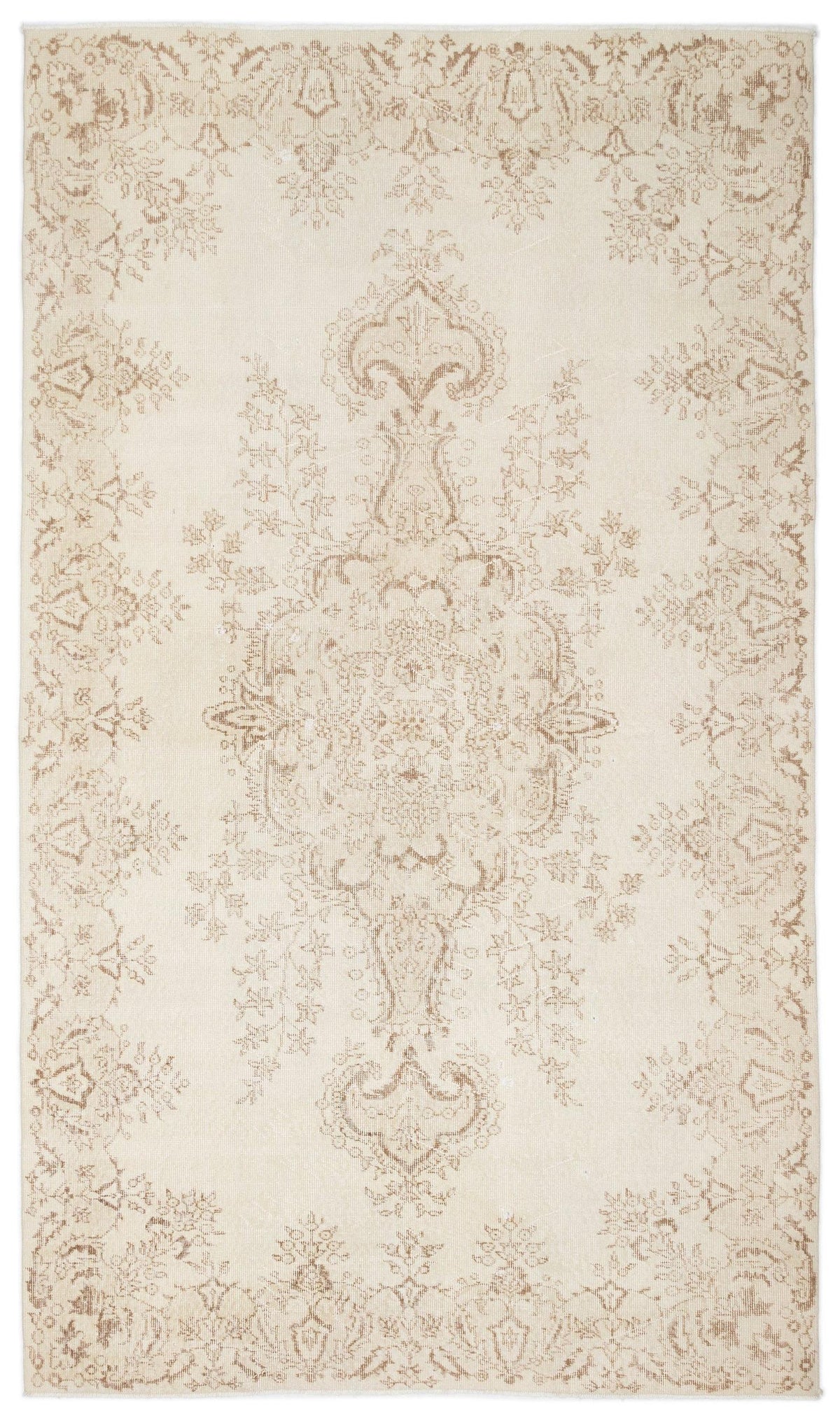 Cream and beige area rug with a central floral medallion and a distressed, traditional Persian-style pattern.