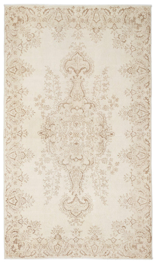 Load image 1 in gallery view. Cream and beige area rug with a central floral medallion and a distressed, traditional Persian-style pattern.