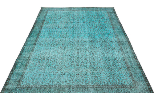 Load image 1 in gallery view. Turquoise and black distressed rug with a traditional ornate floral pattern and a wide border.
