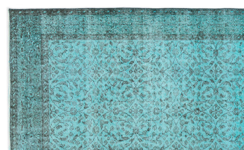 Load image 1 in gallery view. Teal and black distressed rug with a traditional floral medallion pattern and a wide decorative border.