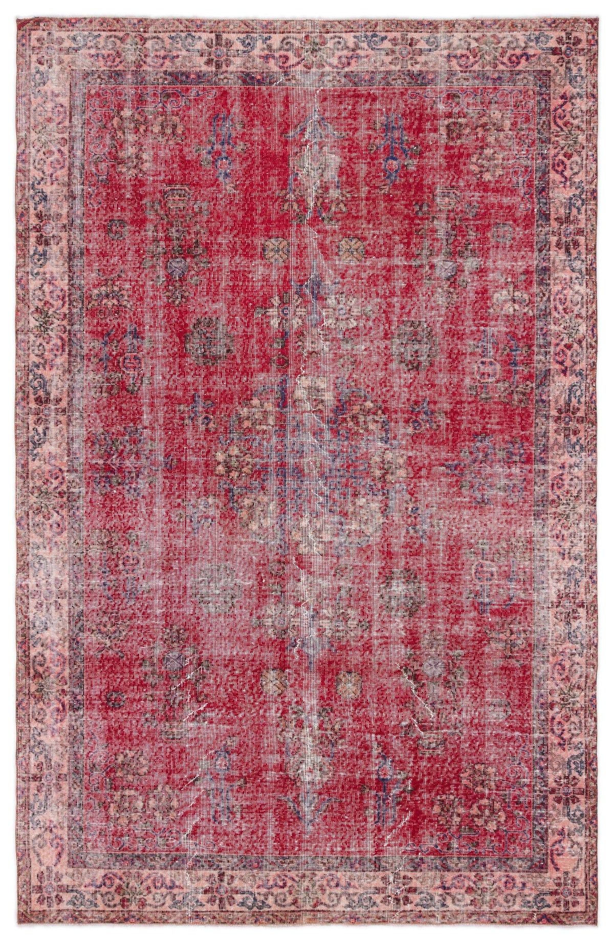 Distressed red vintage-style rug with a faded central medallion and floral border in muted blue and beige tones.