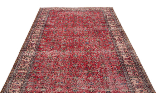 Load image 1 in gallery view. Red vintage-style rug with a distressed floral pattern and intricate border on a white background.