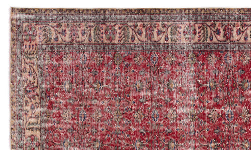 Load image 1 in gallery view. Distressed red traditional rug with a floral pattern and a multi-colored border on a white background.