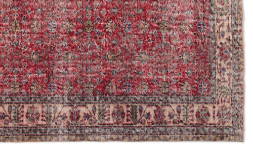 Load image 1 in gallery view. Red traditional rug with a distressed floral pattern and a detailed cream and blue border.