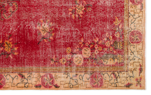Load image 1 in gallery view. Distressed red rug with faded floral motifs and a beige geometric border on a white background.