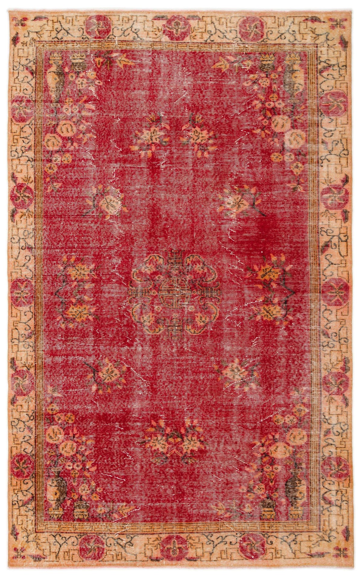 Distressed red rug with a central floral medallion and a beige border featuring geometric and floral motifs.