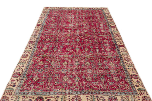 Load image 1 in gallery view. Red and cream traditional rug with a distressed floral pattern and a wide decorative border on a white background.