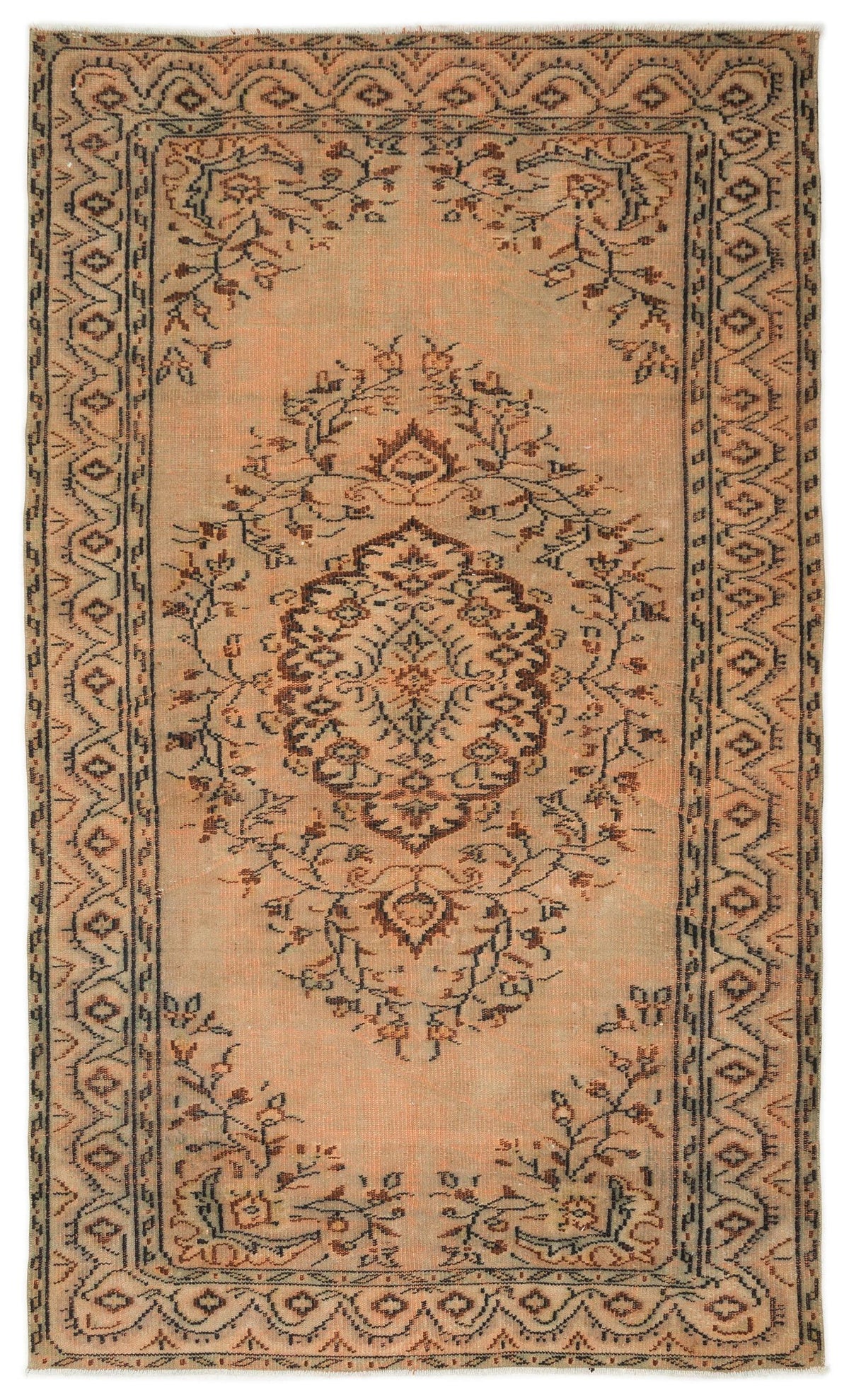 Distressed peach and brown rug with a central floral medallion and a geometric border pattern.