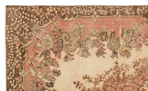Load image 1 in gallery view. Distressed traditional rug with a floral medallion pattern in muted brown, salmon pink, sage green, and cream.