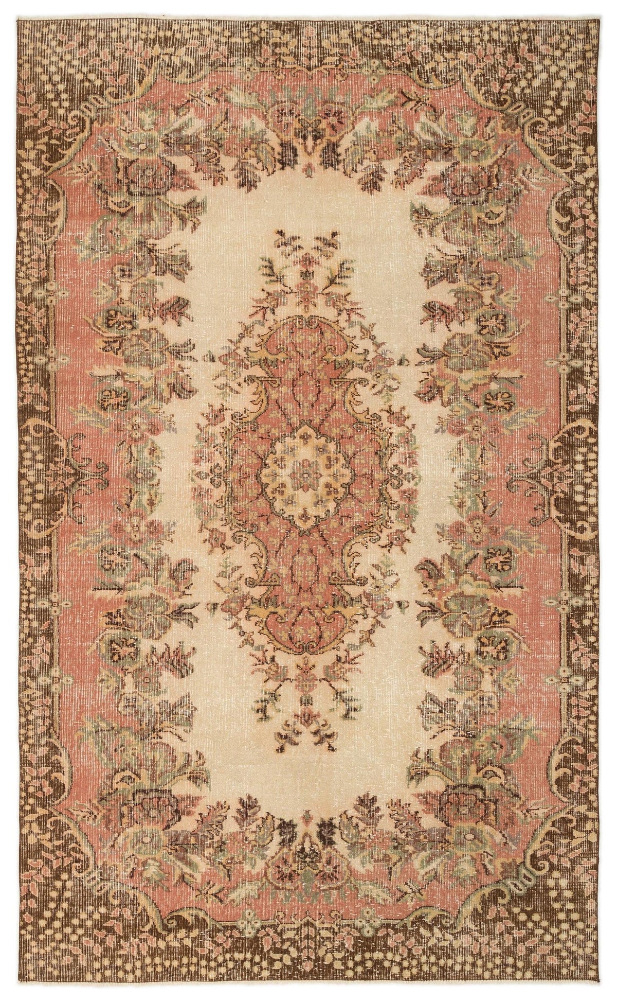 Distressed vintage-style rug with a central floral medallion, pink and cream field, and dark brown floral border.