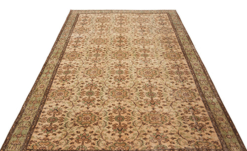 Load image 1 in gallery view. Beige and brown traditional rug with a distressed floral medallion pattern and a dark border on a white background.