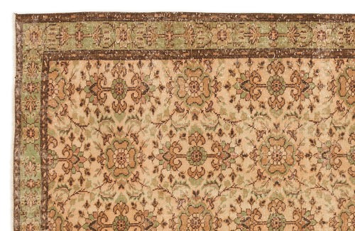 Load image 1 in gallery view. Beige, sage green, and brown vintage-style rug with a repeating floral medallion pattern and a decorative border.