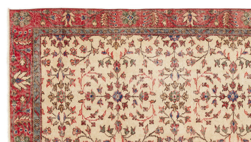 Load image 1 in gallery view. Cream rug with a red border and intricate floral medallion pattern in red, blue, and green.