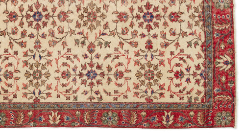 Load image 1 in gallery view. Cream traditional rug with a repeating floral medallion pattern in red, blue, and green, featuring a wide red border.