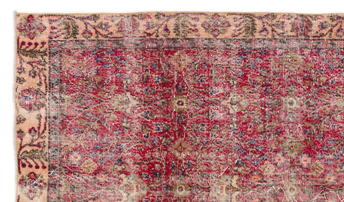 Load image 1 in gallery view. Distressed red and peach traditional rug with a faded floral medallion pattern and intricate border.