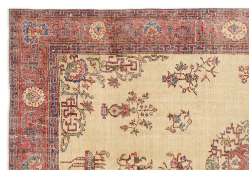 Load image 1 in gallery view. Beige rug with a red and blue geometric border and scattered floral motifs in red, blue, and green.