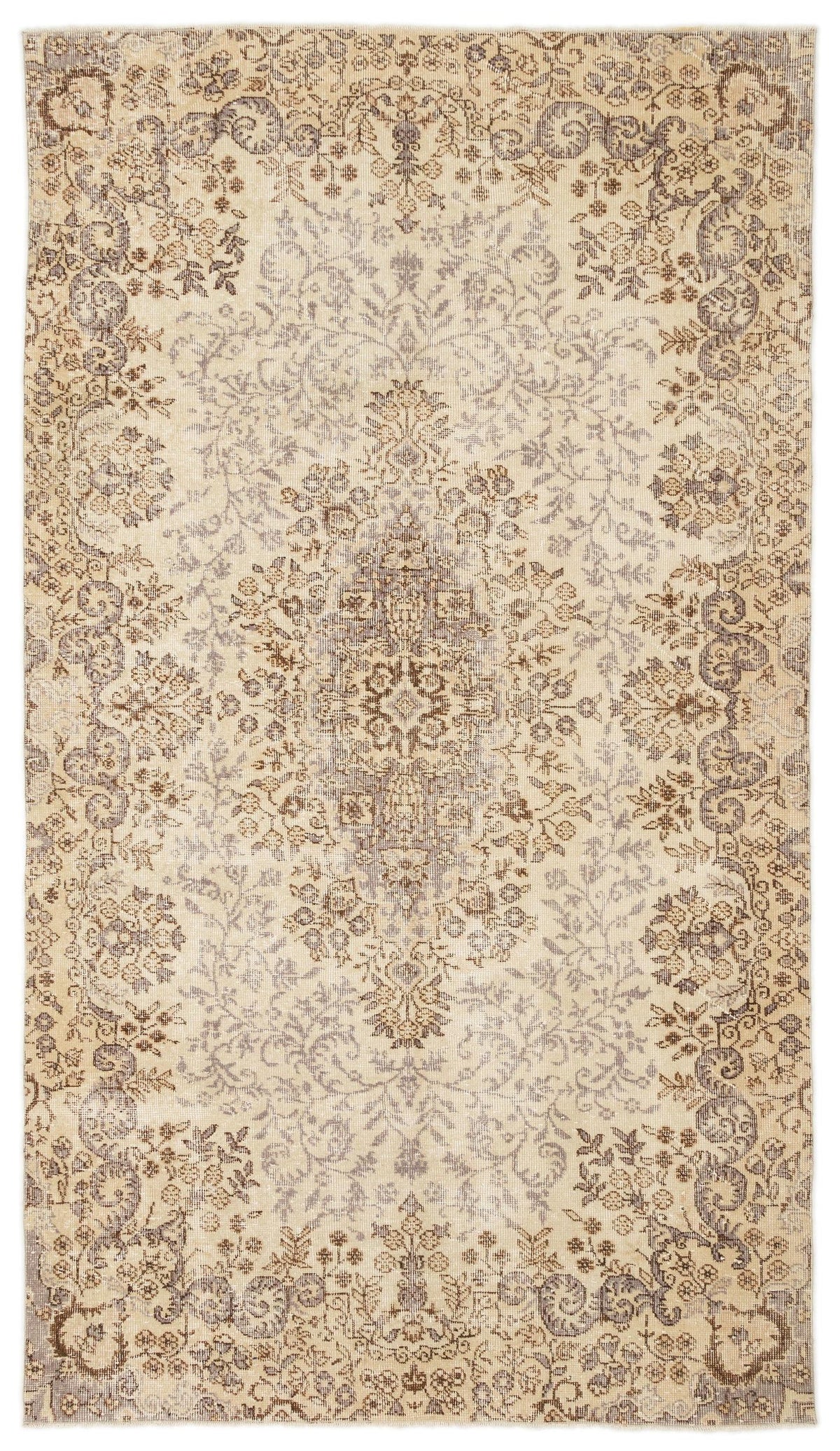 Beige and taupe vintage-style rug with a central floral medallion and intricate botanical border.