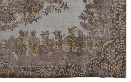 Load image 1 in gallery view. Distressed grey and brown rug with a traditional floral medallion pattern and a detailed border.