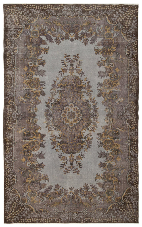 Load image 1 in gallery view. Distressed grey and brown traditional rug with a central floral medallion and ornate border pattern.