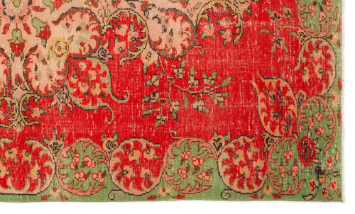 Load image 1 in gallery view. Distressed red rug with green and peach floral medallion border and intricate botanical motifs.