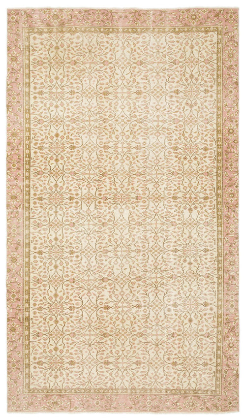 Load image 1 in gallery view. Blush pink and beige vintage-style rug with an intricate floral medallion pattern and a decorative border.