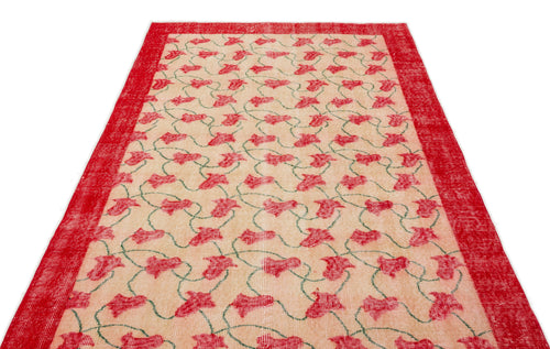 Load image 1 in gallery view. Beige rug with a red floral vine pattern and a solid red border on a white background.