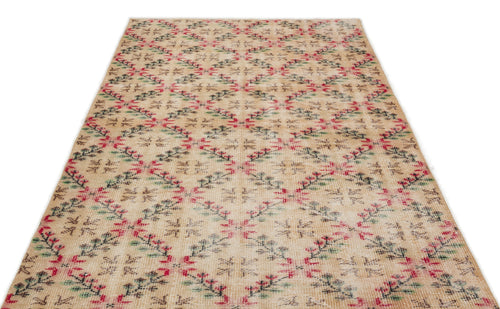 Load image 1 in gallery view. Beige rug with a repeating diamond lattice pattern featuring small red and green floral motifs.