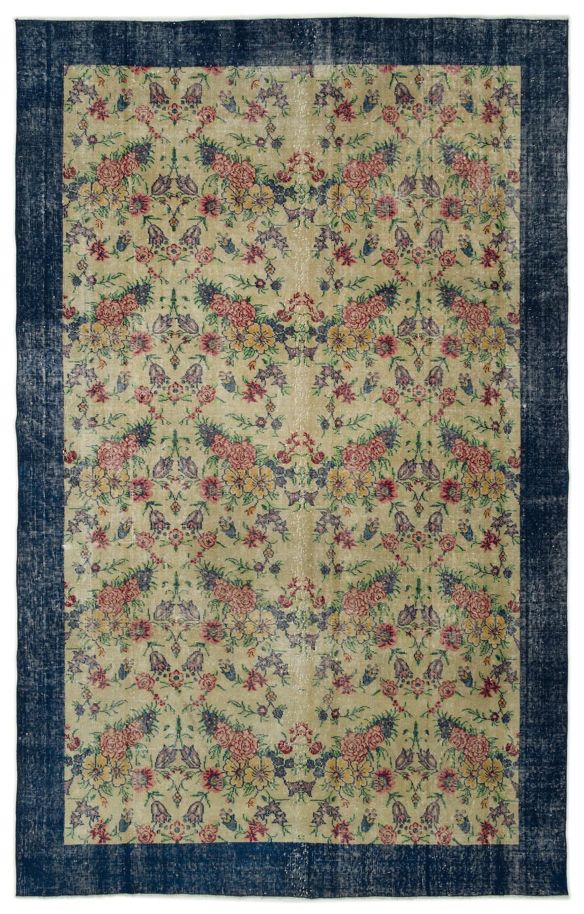 Beige vintage-style rug with a floral pattern in red, yellow, and blue, framed by a wide, distressed navy blue border.