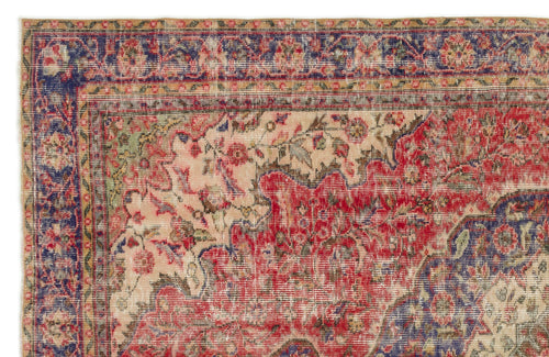 Load image 1 in gallery view. Distressed traditional rug with a red, blue, and beige floral medallion pattern and a multi-layered border.