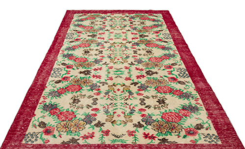 Load image 1 in gallery view. Cream rug with a red border and a repeating floral pattern in red, green, and brown on a white background.