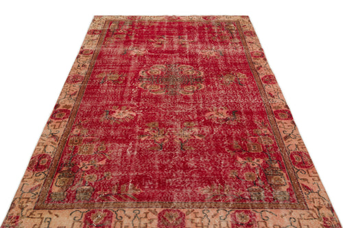 Load image 1 in gallery view. Distressed red and beige vintage-style rug with a central floral medallion and ornate border on a white background.