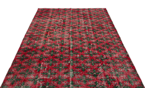 Load image 1 in gallery view. Red and green distressed rug with an all-over geometric floral pattern on a white background.