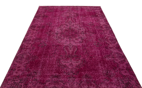 Load image 1 in gallery view. Magenta distressed vintage-style rug with a dark, faded traditional medallion pattern on a white background.